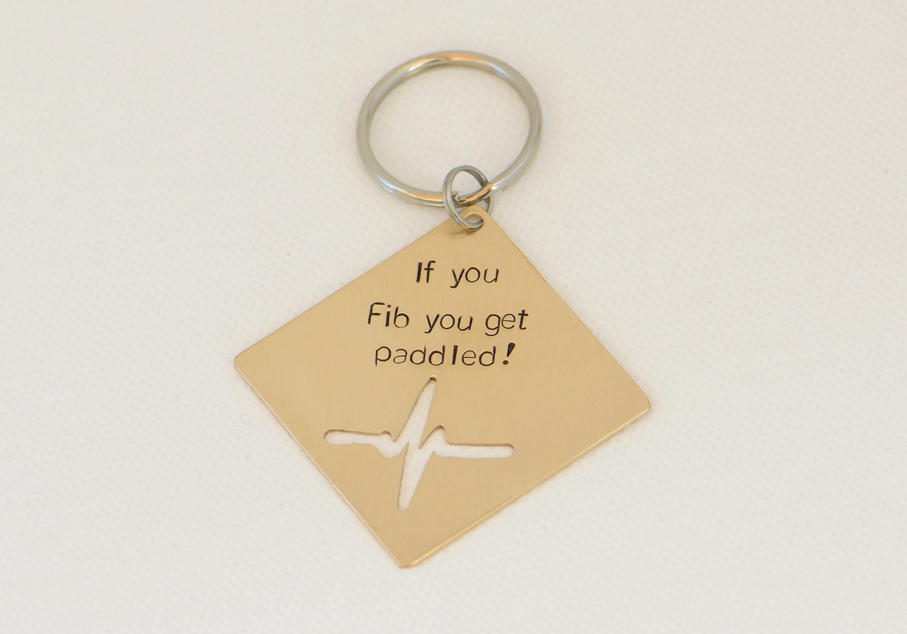 If you Fib you get paddled bronze key chain with heartbeat